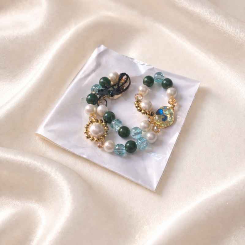 61 Mayur Pearl Phone Charm - Image 1